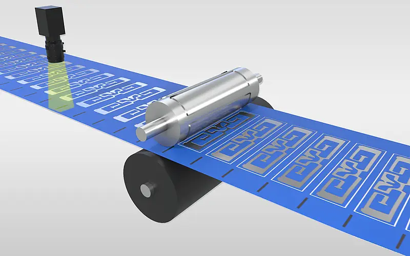 Illustration einer Materialbahn mit gestanzten Formen